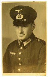 Studio portrait of german soldier in Waffenrock - driver in 75 regiment