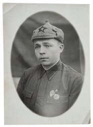 Red Army soldier with badges and Budyonovka hat